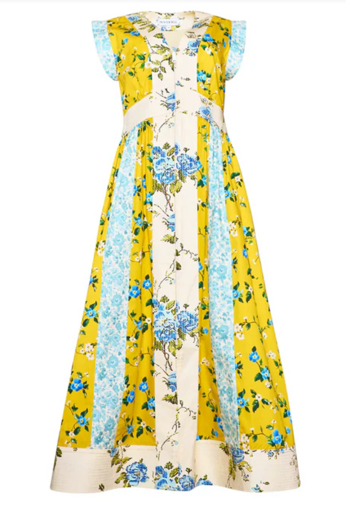 Yellow floral dress with blue accents on a white background