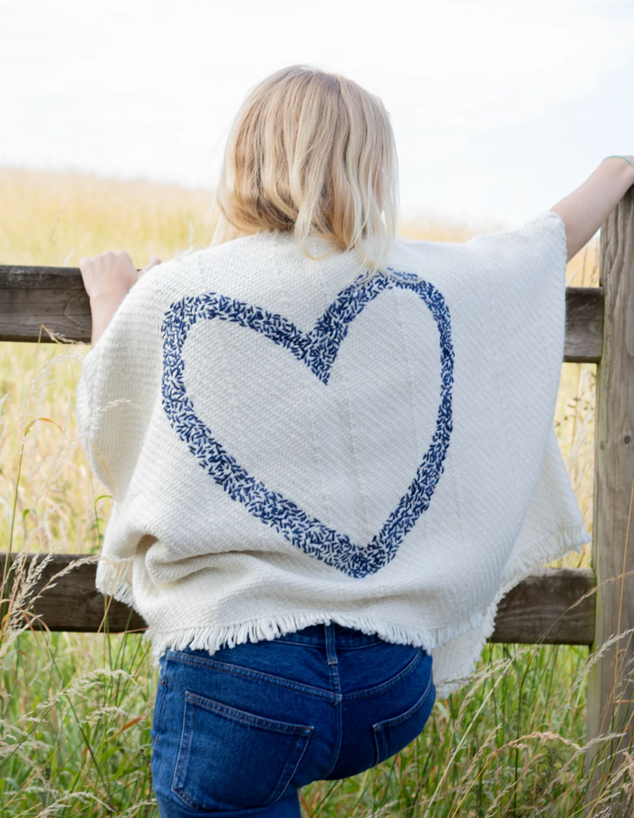 Back View of woman wearing Bella Amora: Navy in outdoor setting next to wooden fence