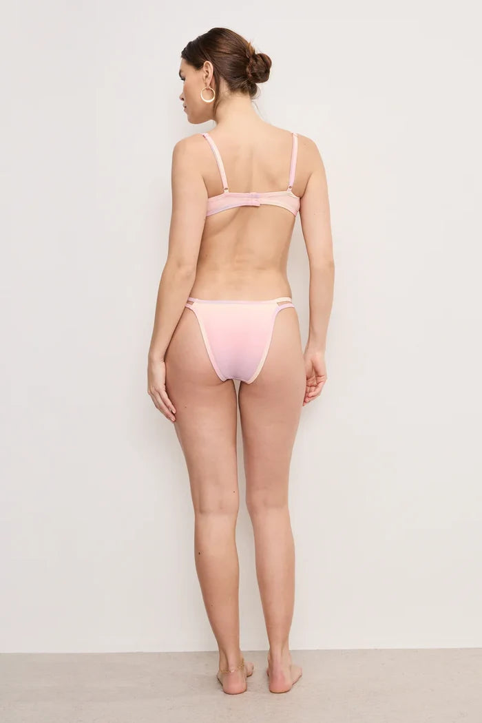 Back View of woman wearing Good American Boomerang Bikini Bottom against a white background