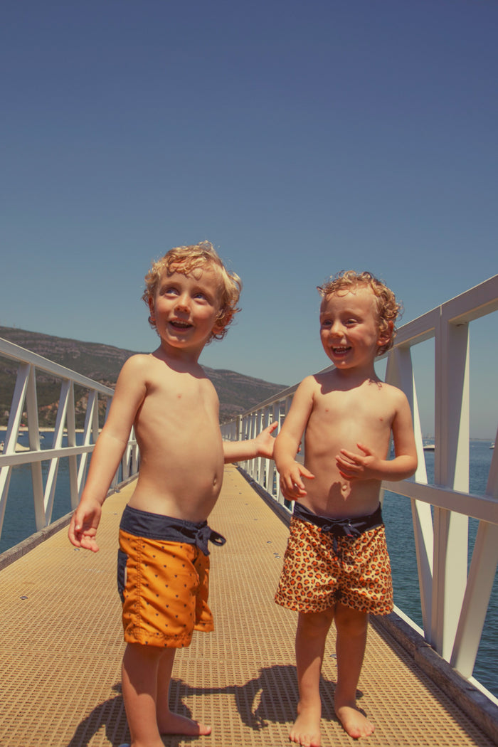 Boy Swim Shorts in Animal Print – Mustard