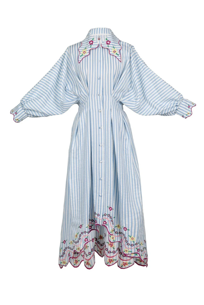 Long, light blue and white striped dress with floral embroidery on a white background