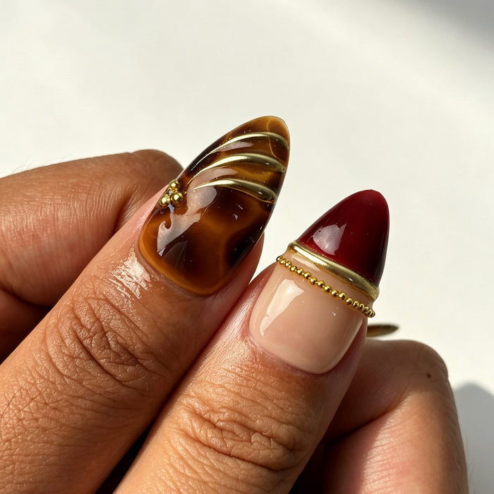 Amber tortoiseshell wine red gradient press‑on nails macro detail shot