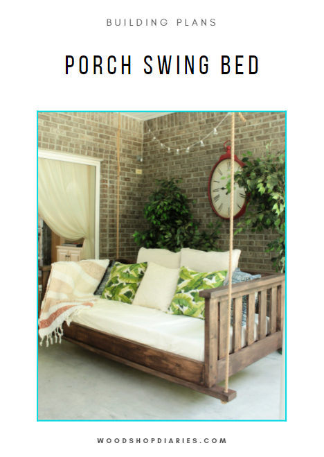 DIY porch swing bed building plans – dark stained wood swing bed hanging on covered porch with cushions and tropical pillows