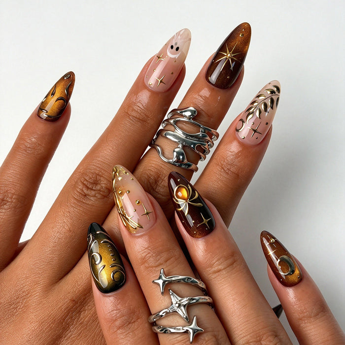 Closeup hand shot of Ember Mystic premium amber brown gold celestial press on nails