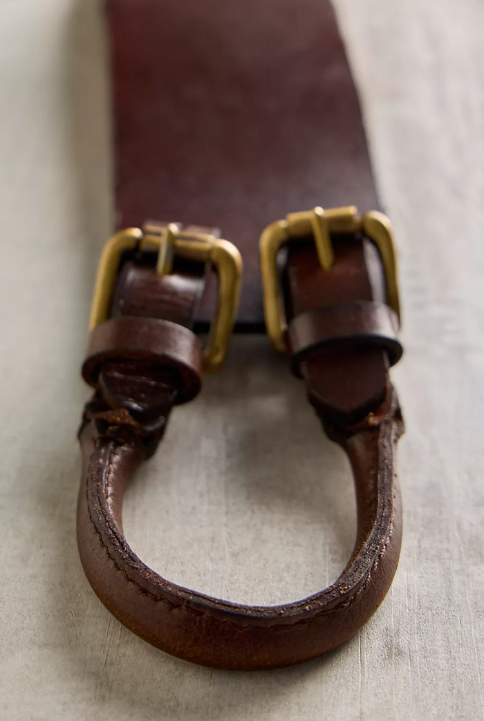 Close-up of a Free People Everhart Hip Belt in Espresso on a light background