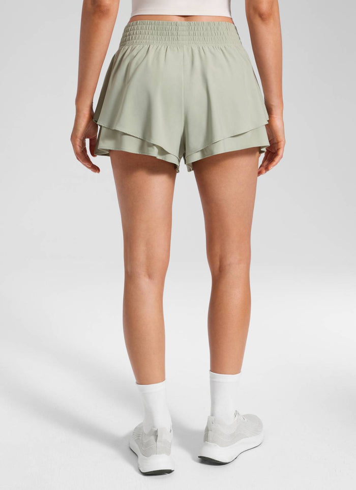 CRZ YOGA Women's Feathery-Fit Drapey Tennis High Rise Flowy Short 2.5" Fog Green