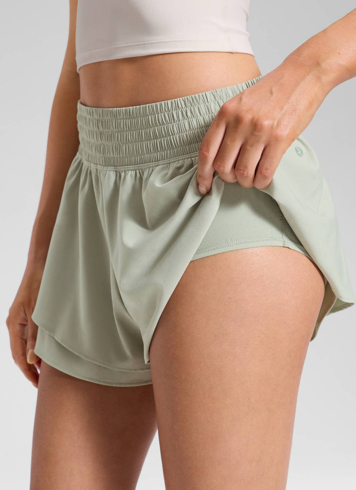CRZ YOGA Women's Feathery-Fit Drapey Tennis High Rise Flowy Short 2.5" Fog Green