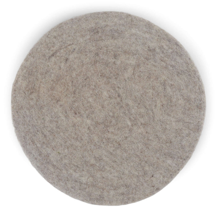 Round felt wool seat cushion in soft gray, handmade from 100% New Zealand wool, ideal for extra comfort on hard surfaces.