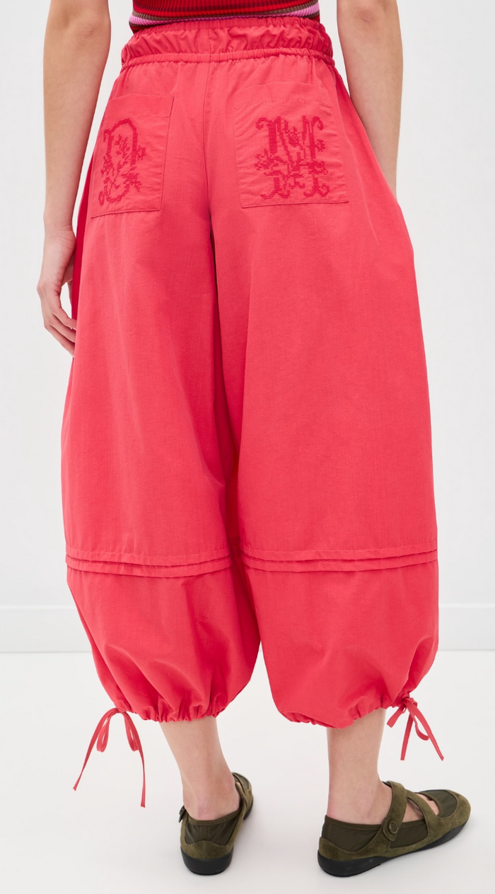 Red pants with drawstrings on a white background