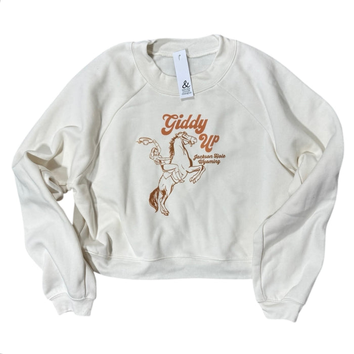 A vintage white sweatshirt with 'Giddy Up' text and a horse graphic design on the front.