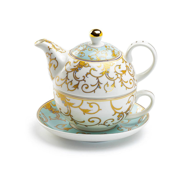 Decorative teapot stacked on top of teacup and saucer with gold and blue patterns on a white background
