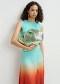 Model holding Essential Antwerp Hamaretto Pouch Neptune Green against white background