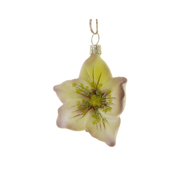 Decorative glass ornament shaped like a flower with a yellow center on a white background