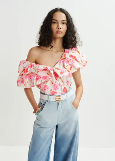A pink bodysuit with a V-neckline and layered ruffle details, underlining bodysuit design, fully lined.