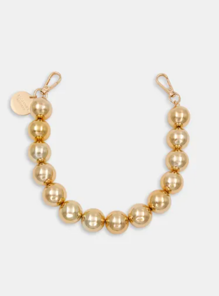 Gold pearl necklace on a white background