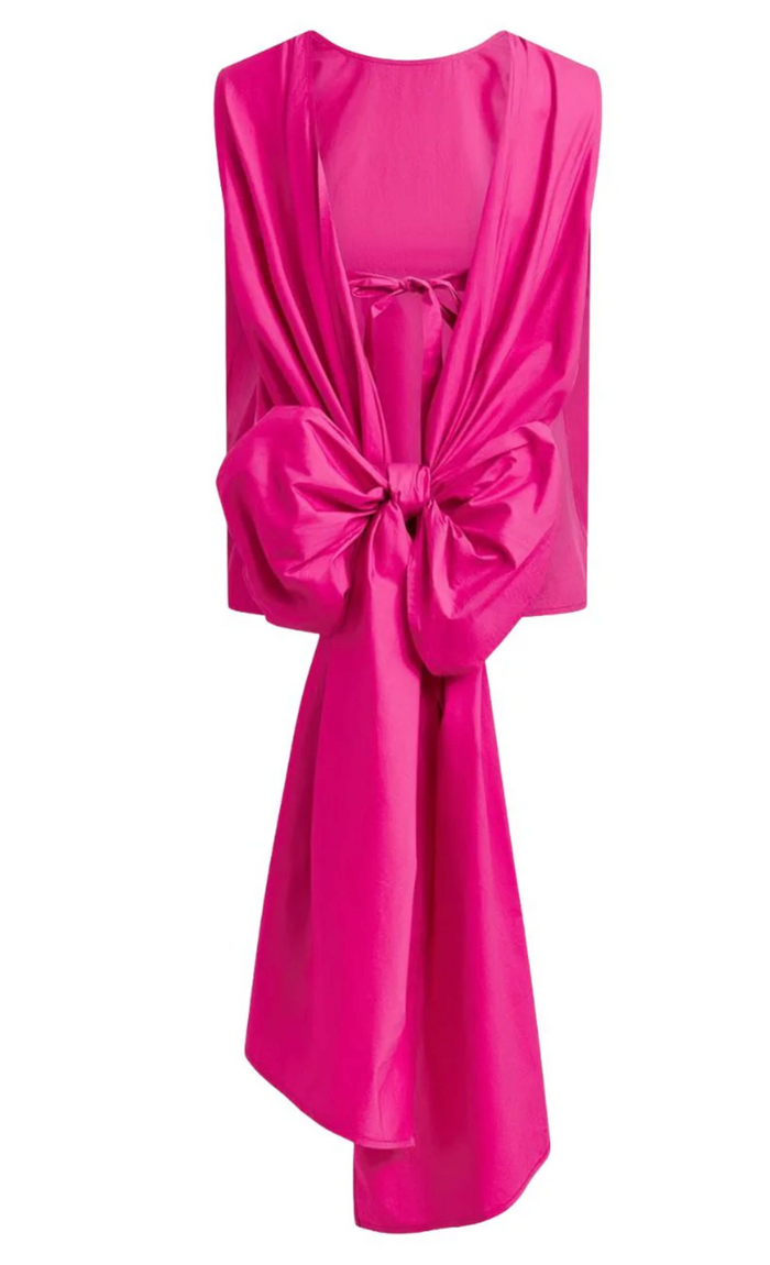 Pink top with a large bow on a white background