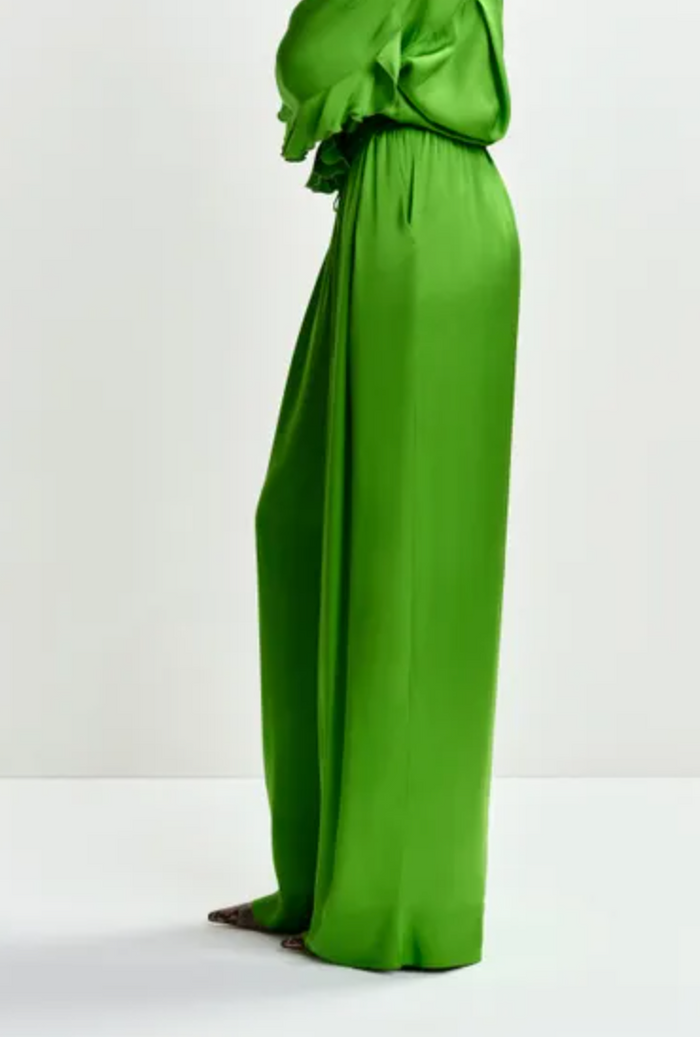 Green satin dress on a white background