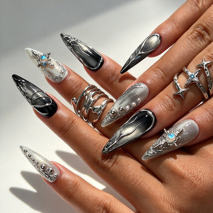 Hand model wearing Lunar Shard long stiletto press on nails, futuristic lunar cyber gothic nail art