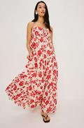 Woman wearing a red floral dress on a white background