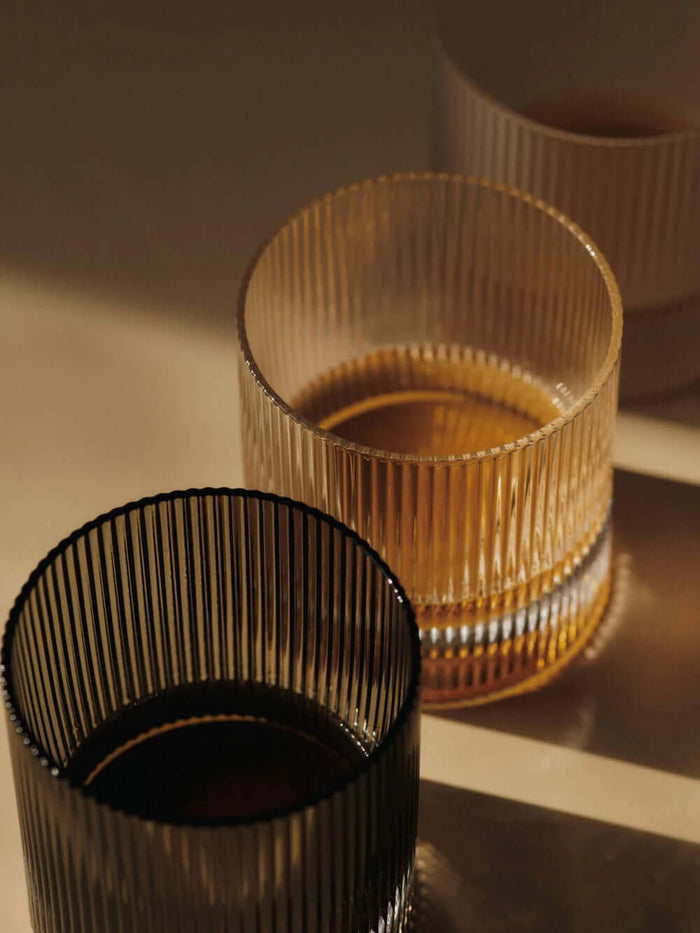 Ripple Tumbler glasses showcasing their rippled design, perfect for enjoying cocktails and beverages, set of 2.