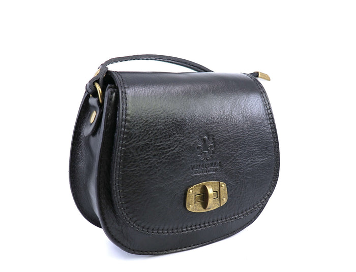 Eclectic black Italian leather crossbody bag with brushed brass twist-lock hardware and structured silhouette.