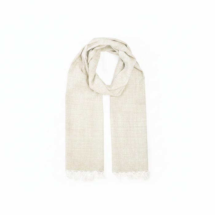 A light beige woven scarf with fringed edges, draped in a looped style against a plain white background.