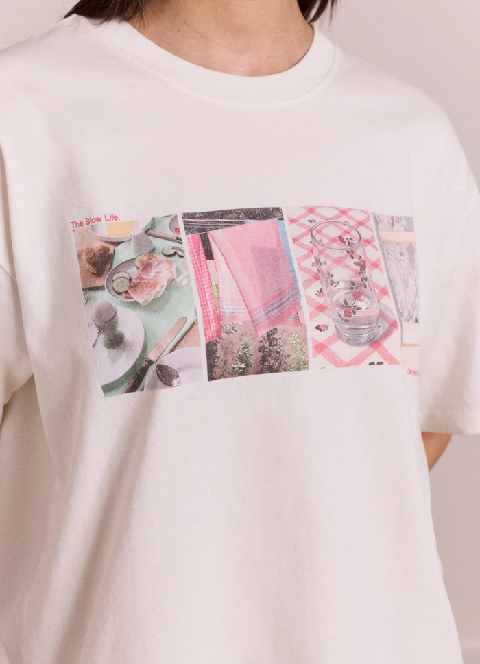 White sweatshirt with a colorful graphic design on a plain background