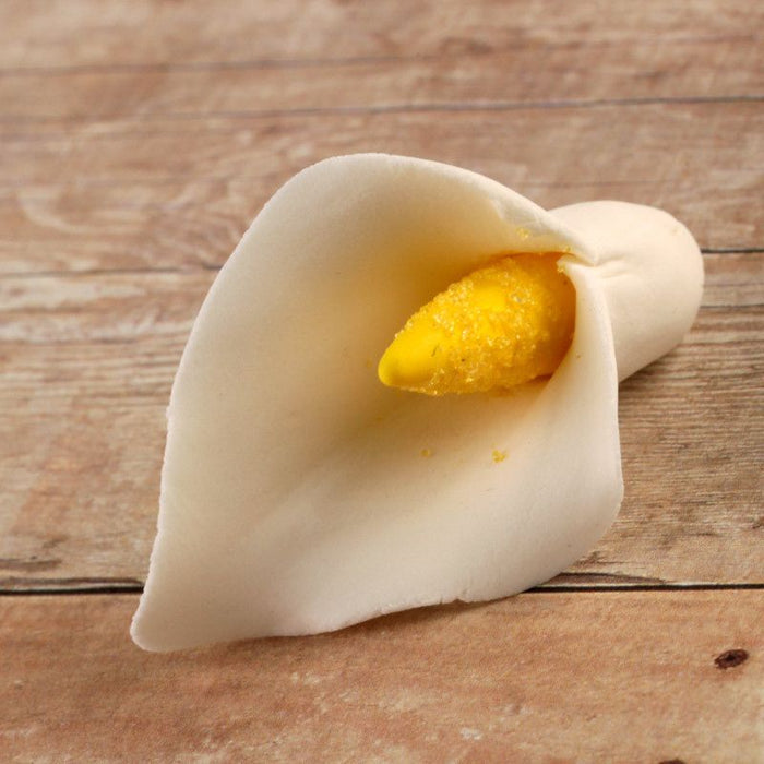 Small gumpaste calla lily cake decoration perfect as a cake topper for cake decorating rolled fondant wedding cakes and rolled fondant birthday cakes, also works as a great cupcake decoration.